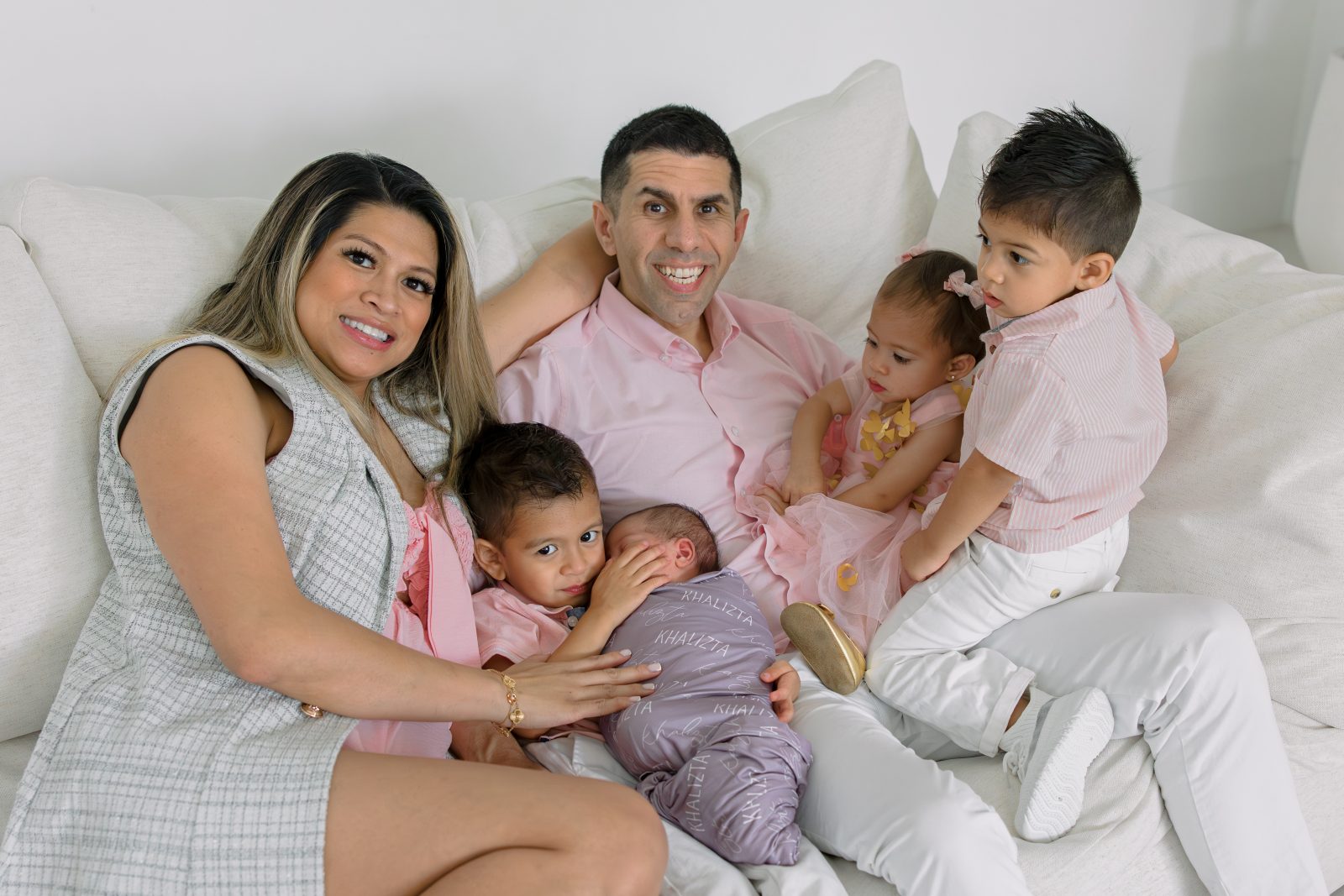 Nelizze and Kash with their four children