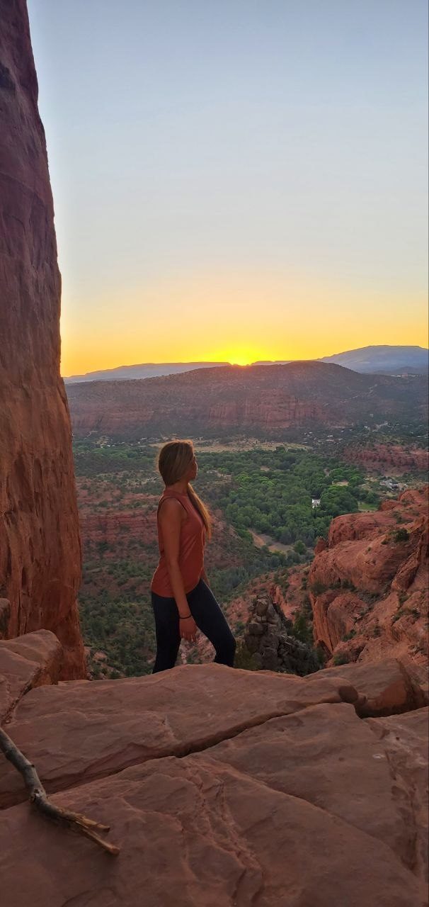 Freedom — Nelizze overlooking a canyon at sunset