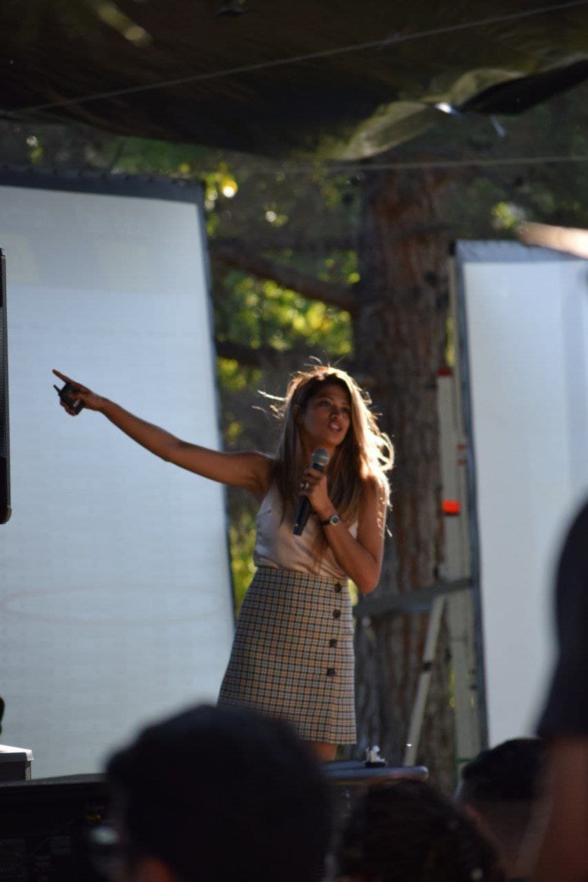 Nelizze speaking on stage